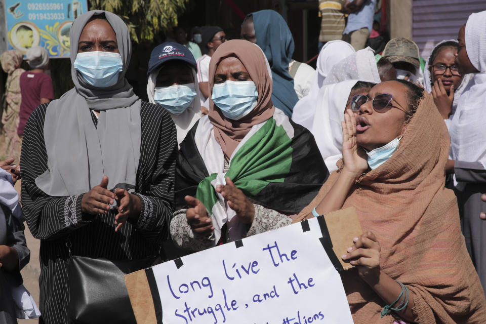 People protests against the October military coup and subsequent deal that reinstated Prime Minister Hamdok in Khartoum, Sudan, Monday, Dec. 6, 2021. (AP Photo/Marwan Ali)