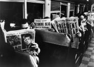 Commuters in New York read of John F. Kennedy’s assassination, Nov. 22, 1963. (Photo: Carl Mydans/The LIFE Picture Collection/Getty Images)