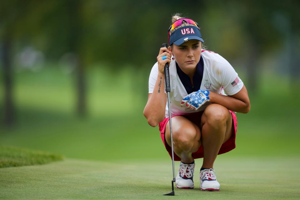 Lexi Thompson of Team USA lines up a putt on the second green during single matches against Team Europe during the Solheim Cup 2024 at Robert Trent Jones Golf Club. Mandatory Credit: Aaron Doster-Imagn Images