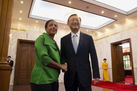 U.S. National Security Advisor Susan Rice (L) shakes hands with Chinese State Councilor Yang Jiechi at the Diaoyutai State Guesthouse in Beijing, China August 28, 2015. REUTERS/Ng Han Guan/Pool