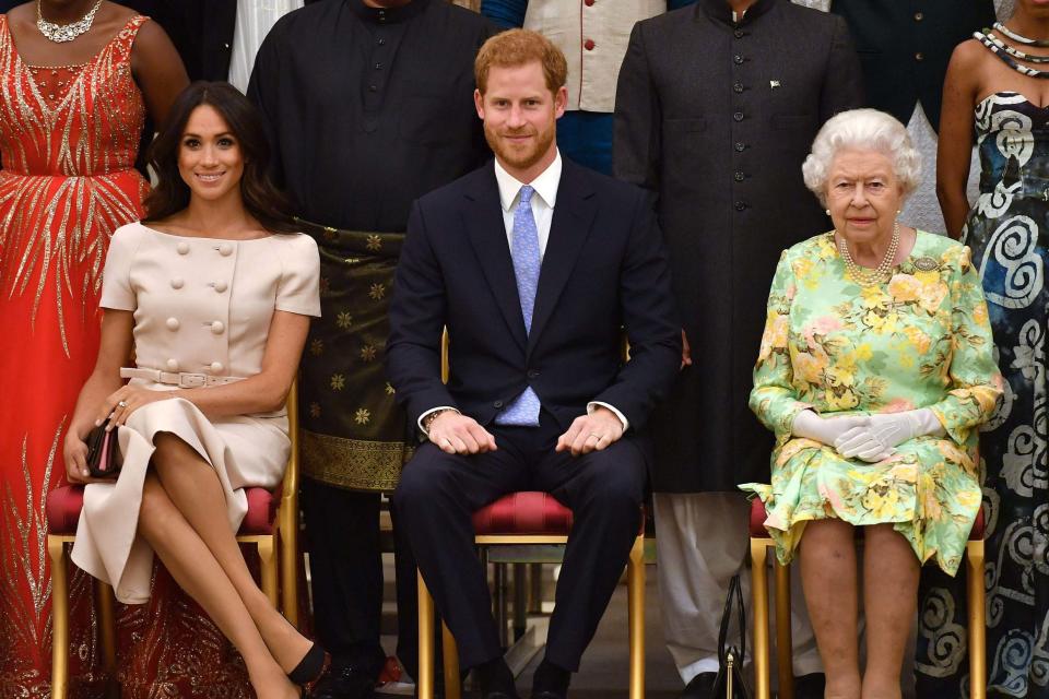 Meghan, Prince Harry and Queen Elizabeth II in June 2018. (POOL/AFP via Getty Images)