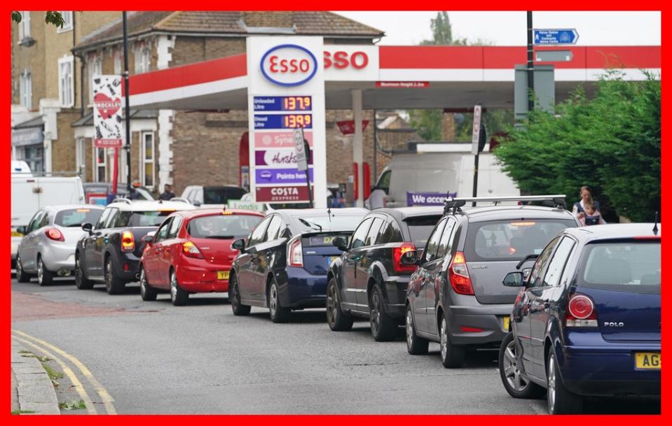 Motorists queue for petrol at an Esso petrol station in Brockley, south London (PA) (PA Media)