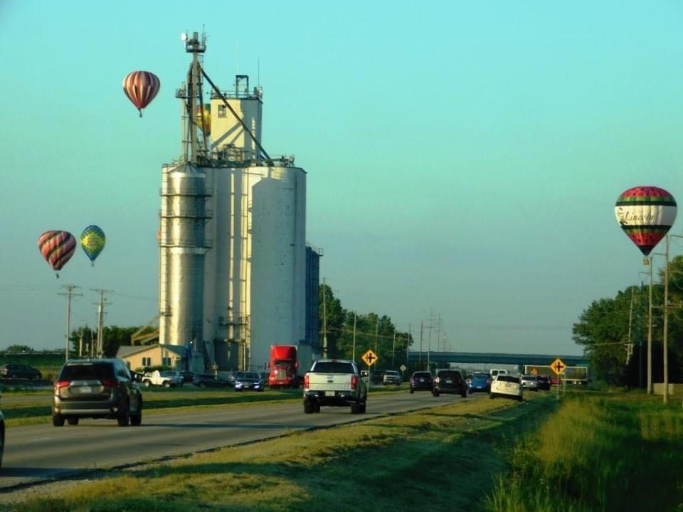 Hot air balloons travel over Route 66 in Lincoln.