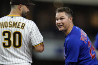 Chicago Cubs' Joc Pederson, right, jokes with San Diego Padres first baseman Eric Hosmer (30) after hitting a single during the sixth inning of a baseball game Tuesday, June 8, 2021, in San Diego. (AP Photo/Gregory Bull)