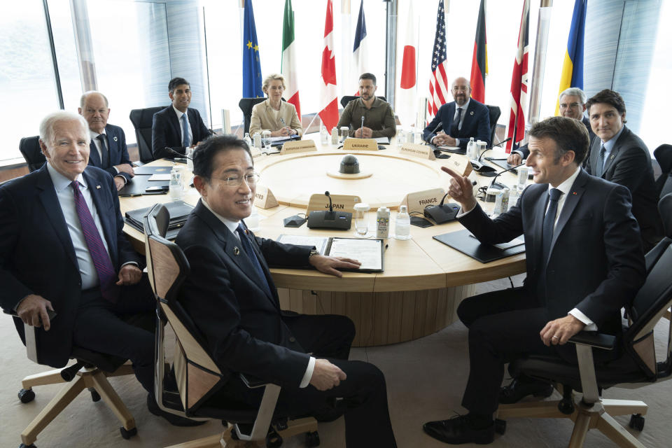 Ukrainian President Volodymyr Zelenskyy, center rear, joins G7 world leaders at a working session on the final day of the G7 Summit in Hiroshima, Japan, Sunday, May 21, 2023. From left to right are: Japan's Prime Minister Fumio Kishida, U.S. President Joe Biden, German Chancellor Olaf Scholz, Britain's Prime Minister Rishi Sunak, European Commission President Ursula von der Leyen, Zelenskyy, European Council President Charles Michel, Gianluigi Benedetti, Italian ambassador to Japan, Canada's Prime Minister Justin Trudeau, and France's President Emmanuel Macron. (Stefan Rousseau/Pool via AP)