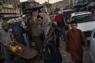 Taliban fighters patrol a market in Kabul's Old City, Afghanistan, Tuesday, Sept. 14, 2021. (AP Photo/Bernat Armangue)