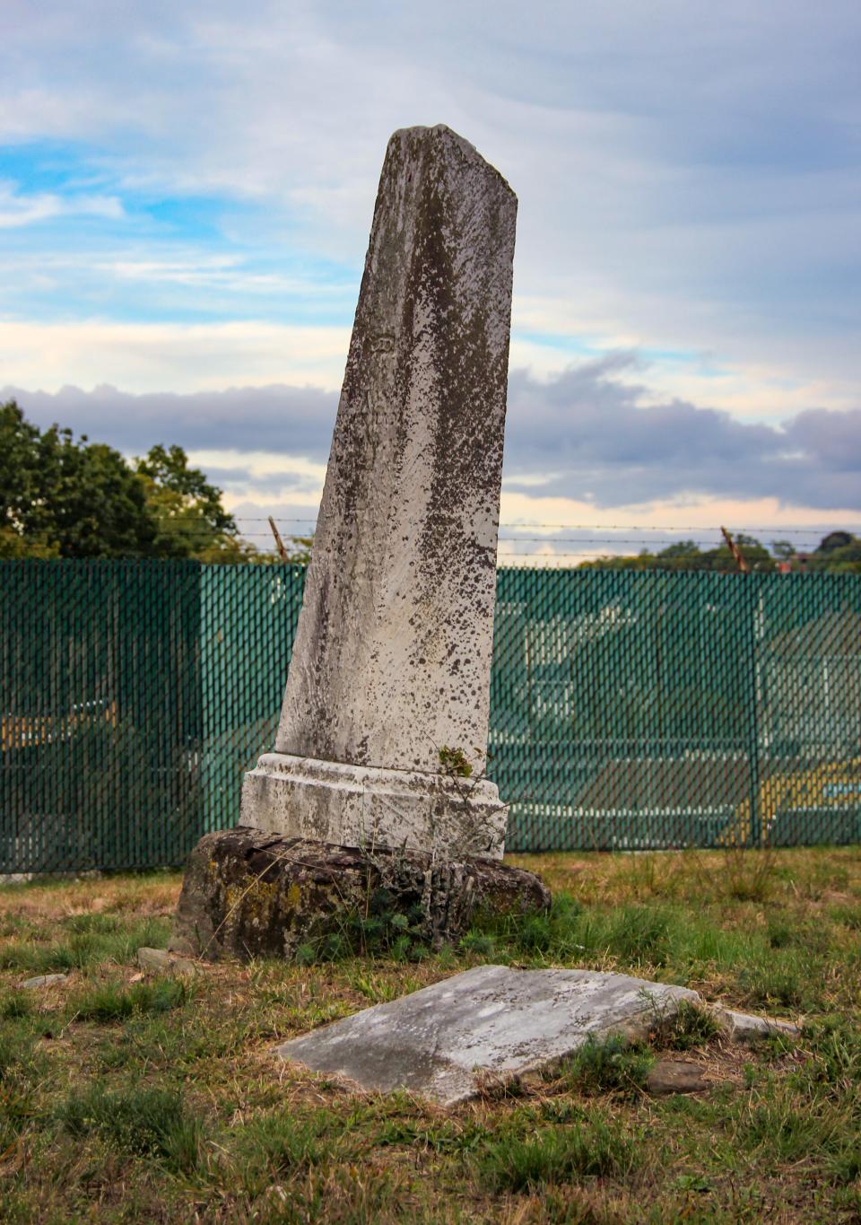 An obelisk grave monument stands at Oak Tree Cemetery in Fall River.