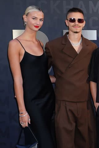 <p>Ian West/PA Images via Getty</p> Romeo Beckham and Mia Regan at the 'Beckham' premiere