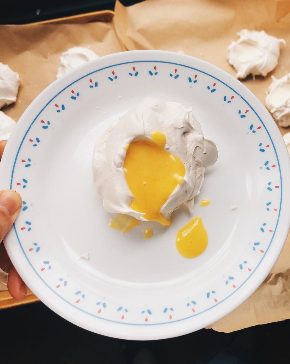 Pillowy meringues filled with lemon curd for dessert