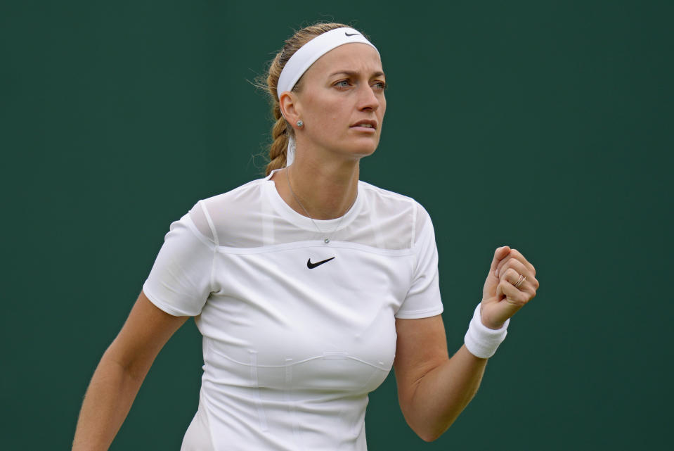 Petra Kvitova of the Czech Republic reacts after winning a point against Romania's Ana Bogdan in a women's singles second round match on day four of the Wimbledon tennis championships in London, Thursday, June 30, 2022. (AP Photo/Kirsty Wigglesworth)