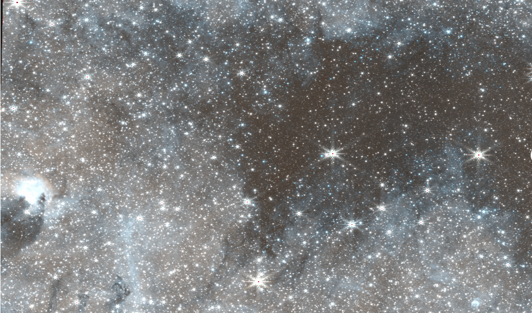  A starry section of space with gaseous patterns in the background. 