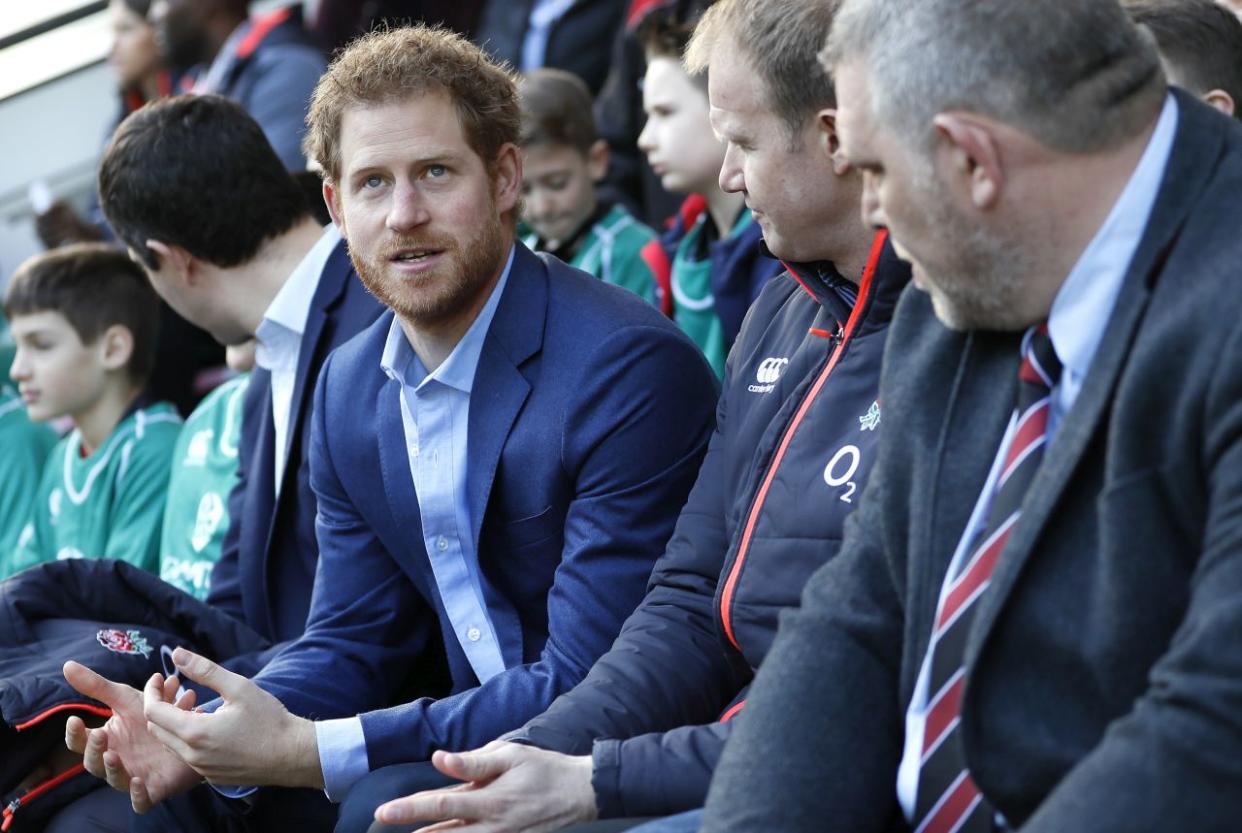 LONDON, ENGLAND - FEBRUARY 17:Britain's Prince Harry speaks with people from the Kids First, Didcot rfc during a visit to an England Rugby Squad training session at Twickenham Stadium on February 17, 2017 in London, England. In his new role as Patron of the Rugby Football Union (RFU), Prince Harry attended the England rugby team open training session. (Photo by Kirsty Wigglesworth - WPA Pool/Getty Images)