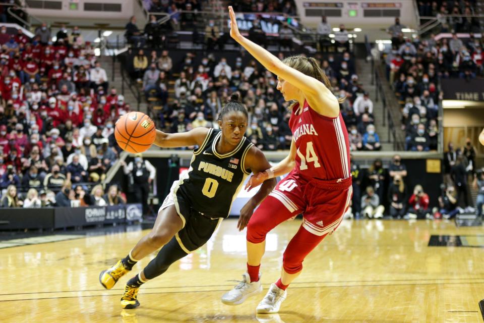 Purdue guard Brooke Moore (0) drives to the net against Indiana guard Ali Patberg (14) during the first quarter of an NCAA women's basketball game, Sunday, Jan. 16, 2022 at Mackey Arena in West Lafayette.