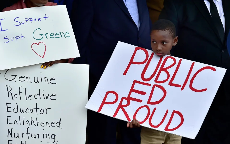 Alfred Montague, 8 holds a sign during the rally in support of Duval County School's superintendent Diana Greene in April.