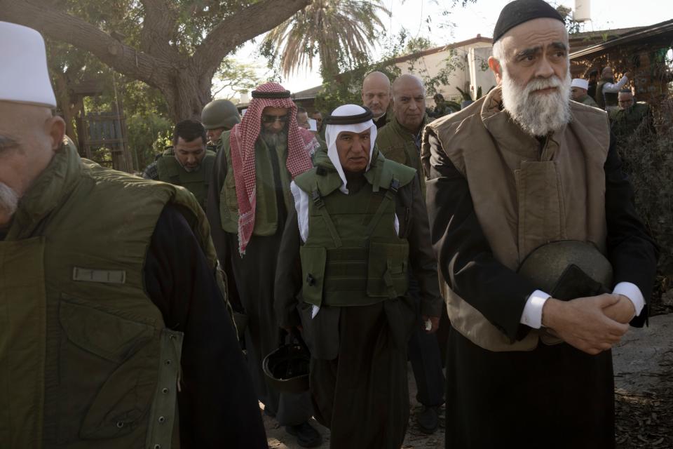 Muslim, Jewish, Druze and Christian faith leaders tour Kibbutz Kfar Azza on Nov. 29, 2023, ahead of an interfaith prayer service near the Israel-Gaza border, the site of the Oct. 7 attack by Hamas.