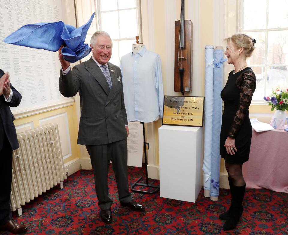 Prince Charles unveils a commemorative plaque to mark his visit at the Emma Willis LTD factory on Feb. 17, 2020 in Gloucester, England.