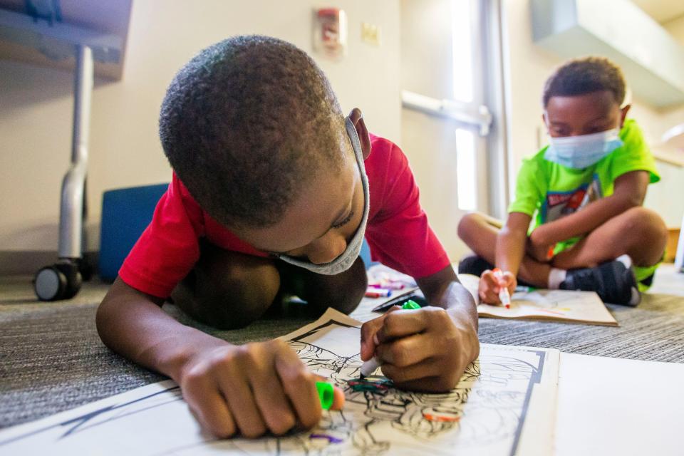 Donovan Hutchen, 8, and Braden Payne-Martin, 7, color Aug. 18, 2021 at the Boys & Girls Clubs' main campus in South Bend.