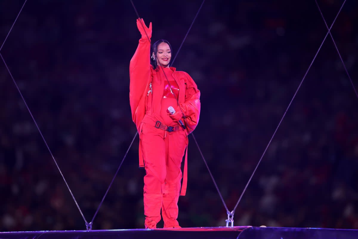 Rihanna sports a custom red jumpsuit designed by Loewe (Getty Images)