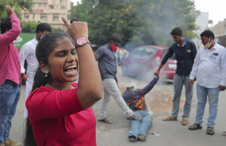 Student activists shout slogans while burning an effigy of Uttar Pradesh state Chief Minister Yogi Adityanath during a protest against the gang rape and killing of a teenager, in Hyderabad, India, Thursday, Oct. 1, 2020. The gang rape and death of a woman from the lowest rung of India’s caste system sparked outrage across the country on Wednesday, with several politicians and activists demanding justice and protesters rallying in the streets. The attack of the 19-year-old is the latest gruesome case of sexual violence against women to rile India, where reports of rape are hauntingly familiar. (AP Photo/Mahesh Kumar A.)