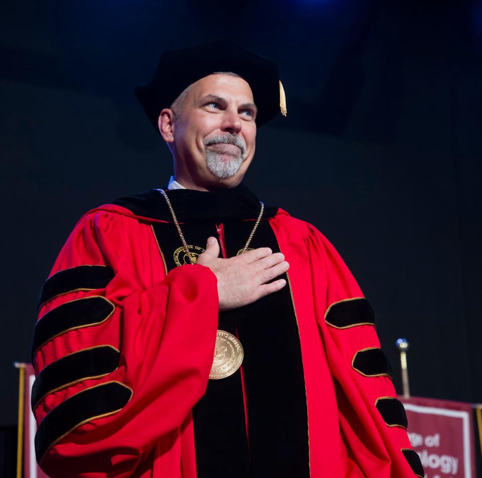 Florida Tech President John Nicklow takes a moment on stage during his investiture.