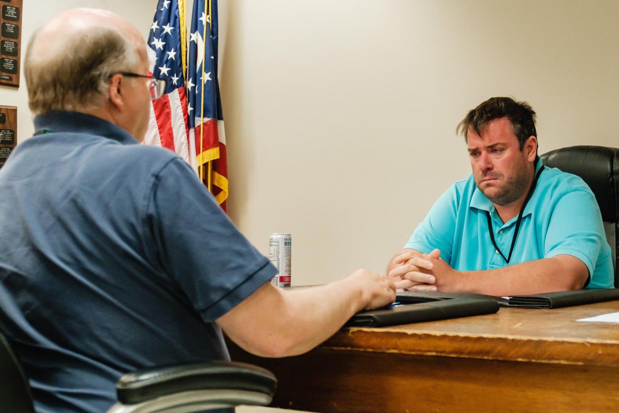 Mark J. Waltz, left, and Jeremiah M. Johnson, right, are shown during Monday morning's meeting of the Tuscarawas County Board of Elections.