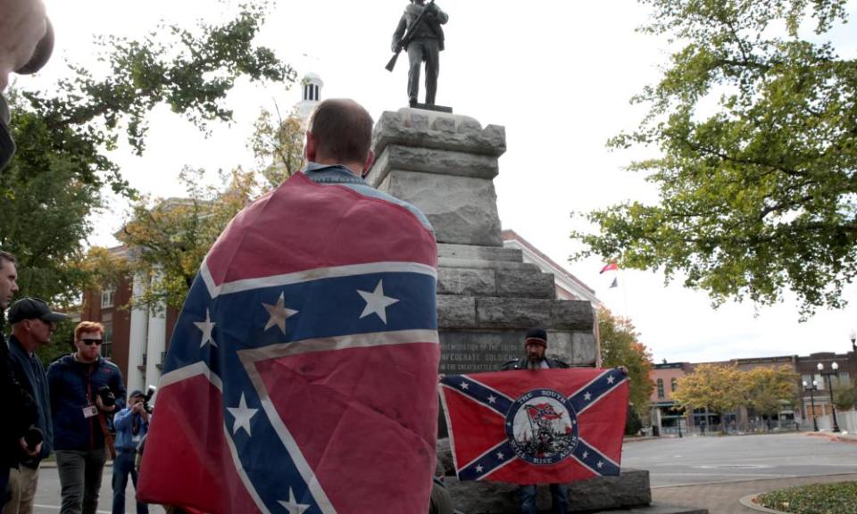 People hold Confederate flags during the ‘White Lives Matter’ rally in Murfreesboro.