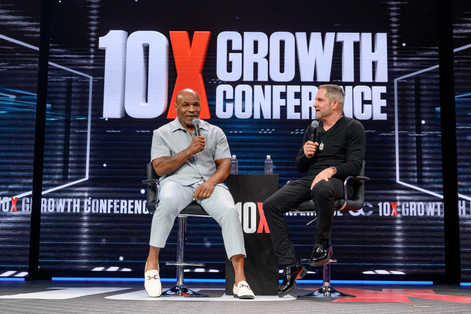 Mike Tyson attends the 10X Growth Conference in a pair of white Gucci Horsebit Loafers