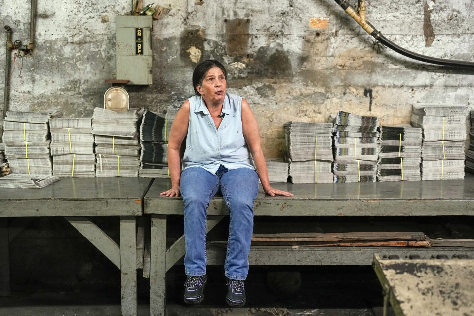 Missy Nester owner of the The Welch News sits in the pressroom of the now closed office on Wednesday, May 31, 2023, in Welch, W.Va. In March, the weekly publication in McDowell County one of the poorest counties America became another one of the quarter of all U.S. newspapers that have shuttered since 2005, a crisis Nester called "terrifying for democracy" and one that disproportionately impacts rural America. (AP Photo/Chris Carlson)