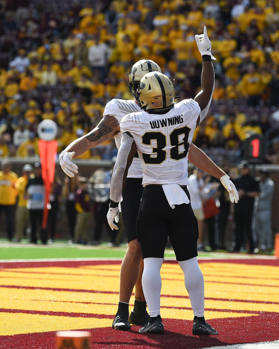 Purdue running back Dylan Downing (38) celebrates with tight end Payne Durham after scoring a touchdown against Minnesota during the first half an NCAA college football game on Saturday, Oct. 1, 2022, in Minneapolis. (AP Photo/Craig Lassig)