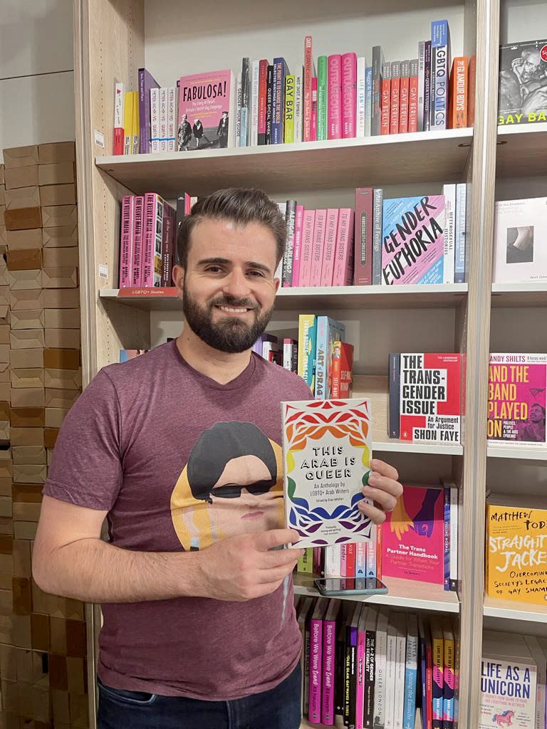 Elias Jahshan, the Editor of 'This Arab is Queer,' with a copy of the anthology.<span class="copyright">Elias Jahshan</span>