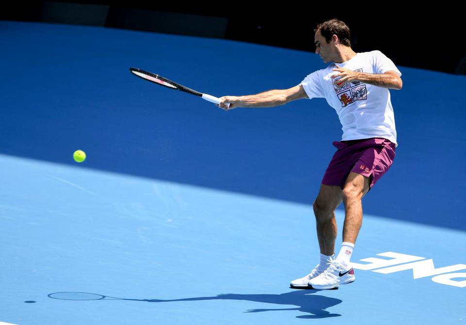 Roger Federer hits a return during a practice session ahead of the Australia Open tennis tournament in Melbourne on January 18, 2020. (Photo by William WEST / AFP)