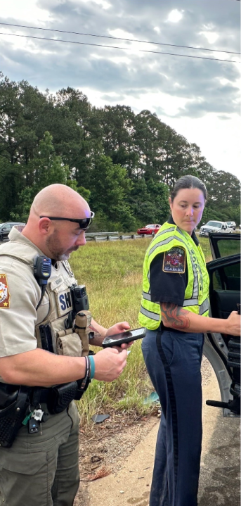 Left to Right: Deputy Dustin Oswald and Trooper Spencer Adkinson on the scene- Courtesy of RickeyStokesNews