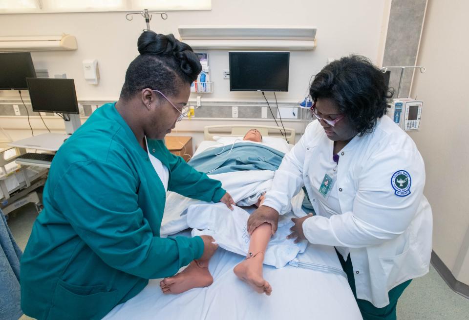 Students Watice Shoemaker, left, and Nicole Haynes practice their skills during an Into To Nursing class at the Pensacola State College - Warrington Campus on Thursday, Jan. 19, 2023.