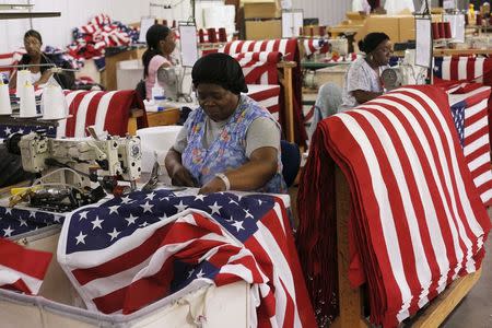 Daisy Nesmith sews U.S. flags at Valley Forge's manufacturing facility in Lane, South Carolina June 23, 2015. REUTERS/Brian Snyder