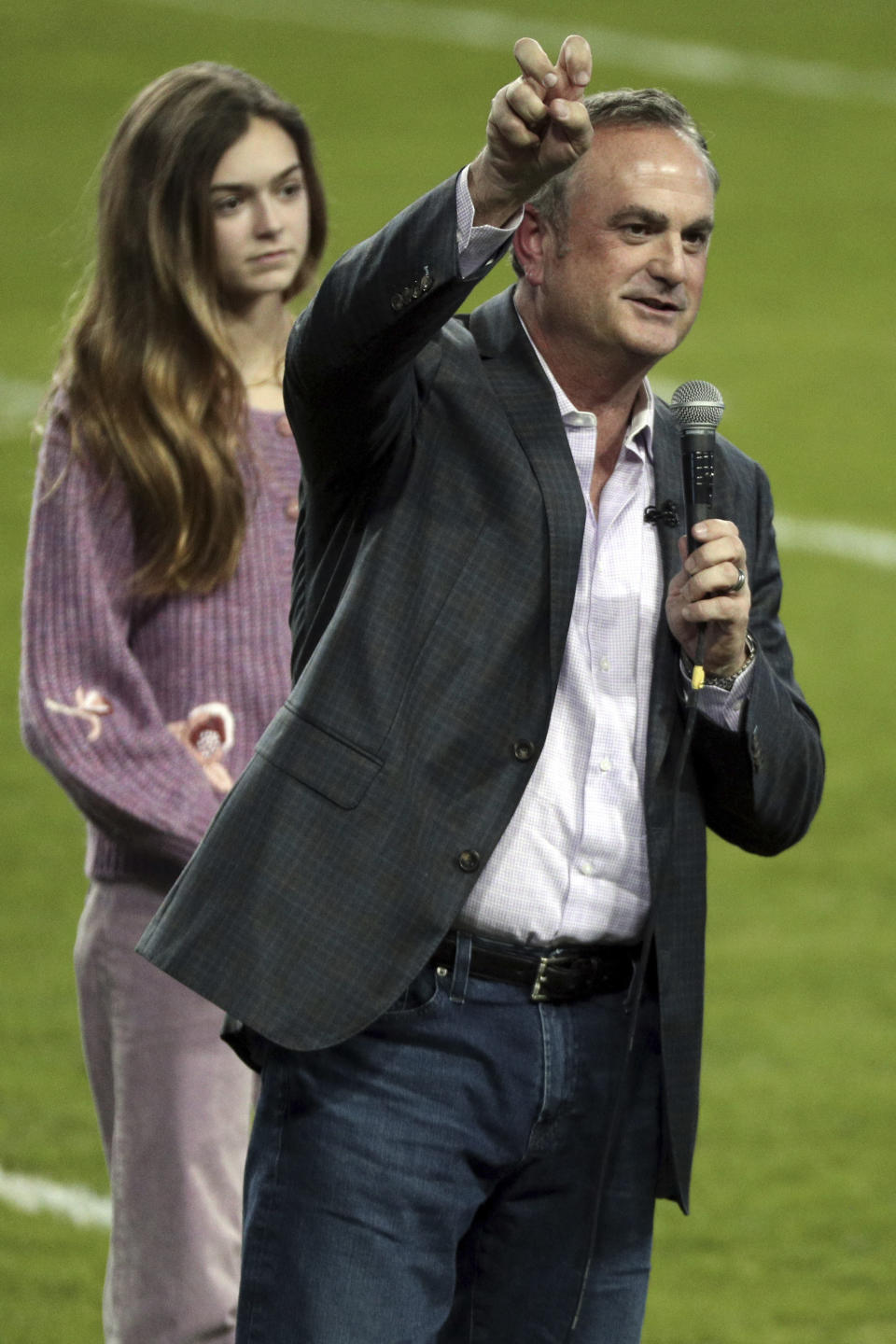 Sonny Dykes does the horned frog salute after being introduced and addressing the crowd as the new TCU head football coach at an event at Amon G. Carter Stadium at Texas Christian University, Monday, Nov. 29, 2021, in Fort Worth, Texas. (AP Photo/Richard W. Rodriguez)