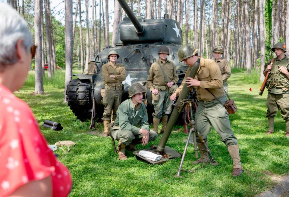 Jonathan Rowell and fellow members of the The Furious Fourth World War II Living History Association do a demonstration during the World War II encampment at the Pennsylvania Military Museum on Saturday, May 27, 2023.