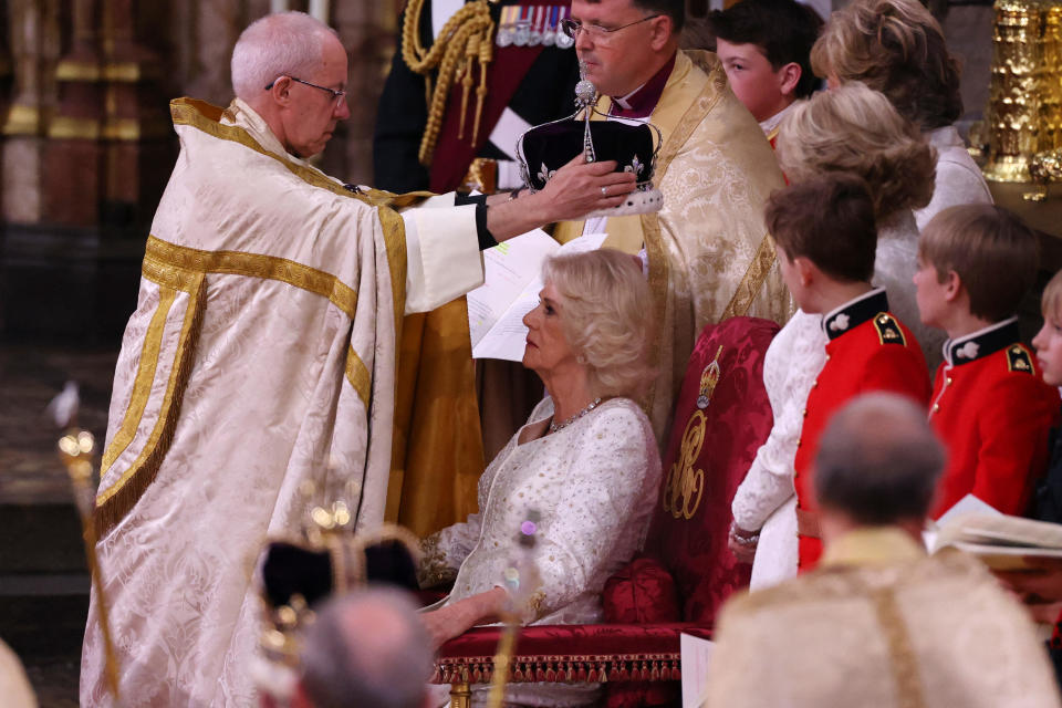 The Archbishop of Canterbury Justin Welby places the Queen Mary's Crown onto the head of Camilla during the coronation ceremony inside Westminster Abbey in London, on May 6, 2023. / Credit: RICHARD POHLE/POOL/AFP via Getty Images