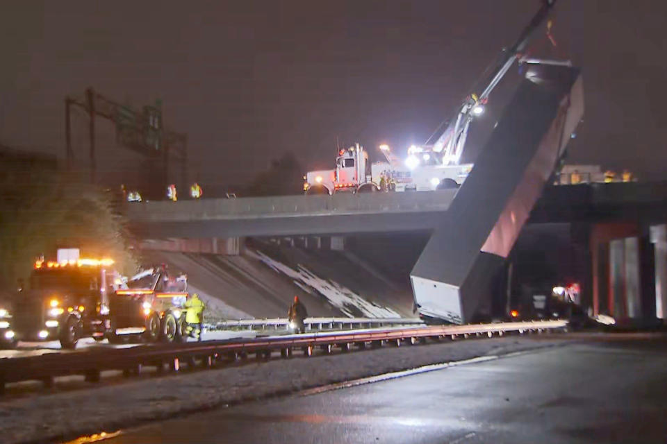 A tractor-trailer slid off the N.C. Highway 147 bridge in Durham late Sunday.  (via WRAL)