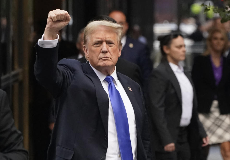 TOPSHOT - Former US president and Republican presidential candidate Donald Trump raises a fist as he returns to Trump Tower after being convicted in his criminal trial in New York City on May 30, 2024.  A panel of twelve New Yorkers was unanimous in their finding that Donald Trump is guilty as charged – but because of the impact on his election prospects, the jury is still out.  The Republican billionaire was convicted of all 34 charges in New York on May 30, 2024, and now he must run for a second presidential term, unsure whether he will spend all of 2025 in the Oval Office, on probation or in prison.  (Photo by TIMOTHY A. CLARY/AFP) (Photo by TIMOTHY A. CLARY/AFP via Getty Images)