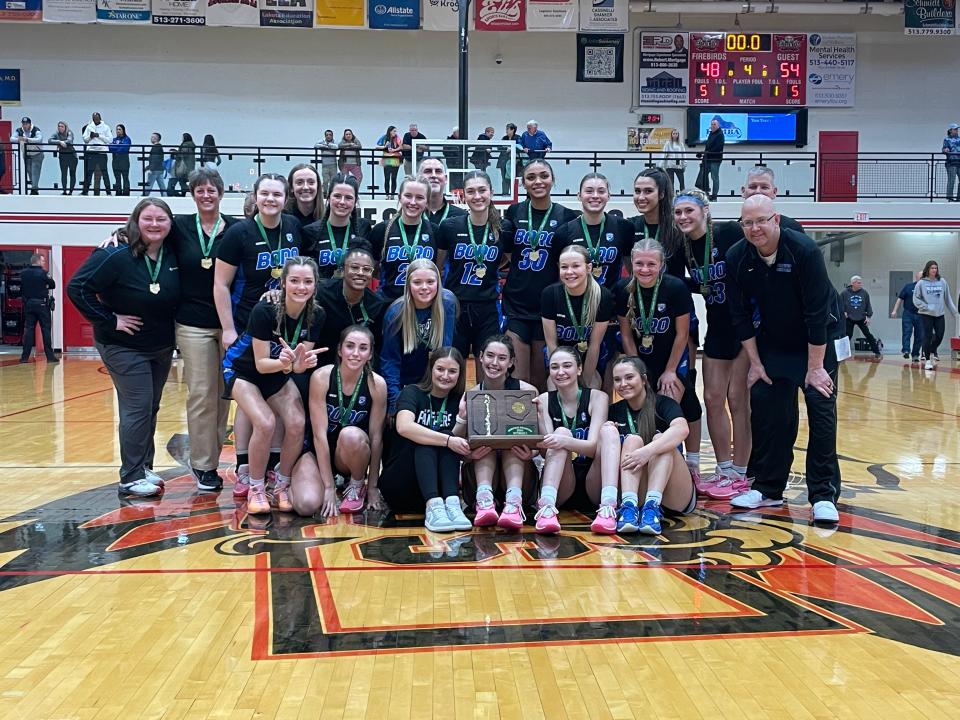 The Springboro Panthers celebrate with their regional championship trophy after defeating Mount Notre Dame 54-48 March 9 at Lakota West High School.