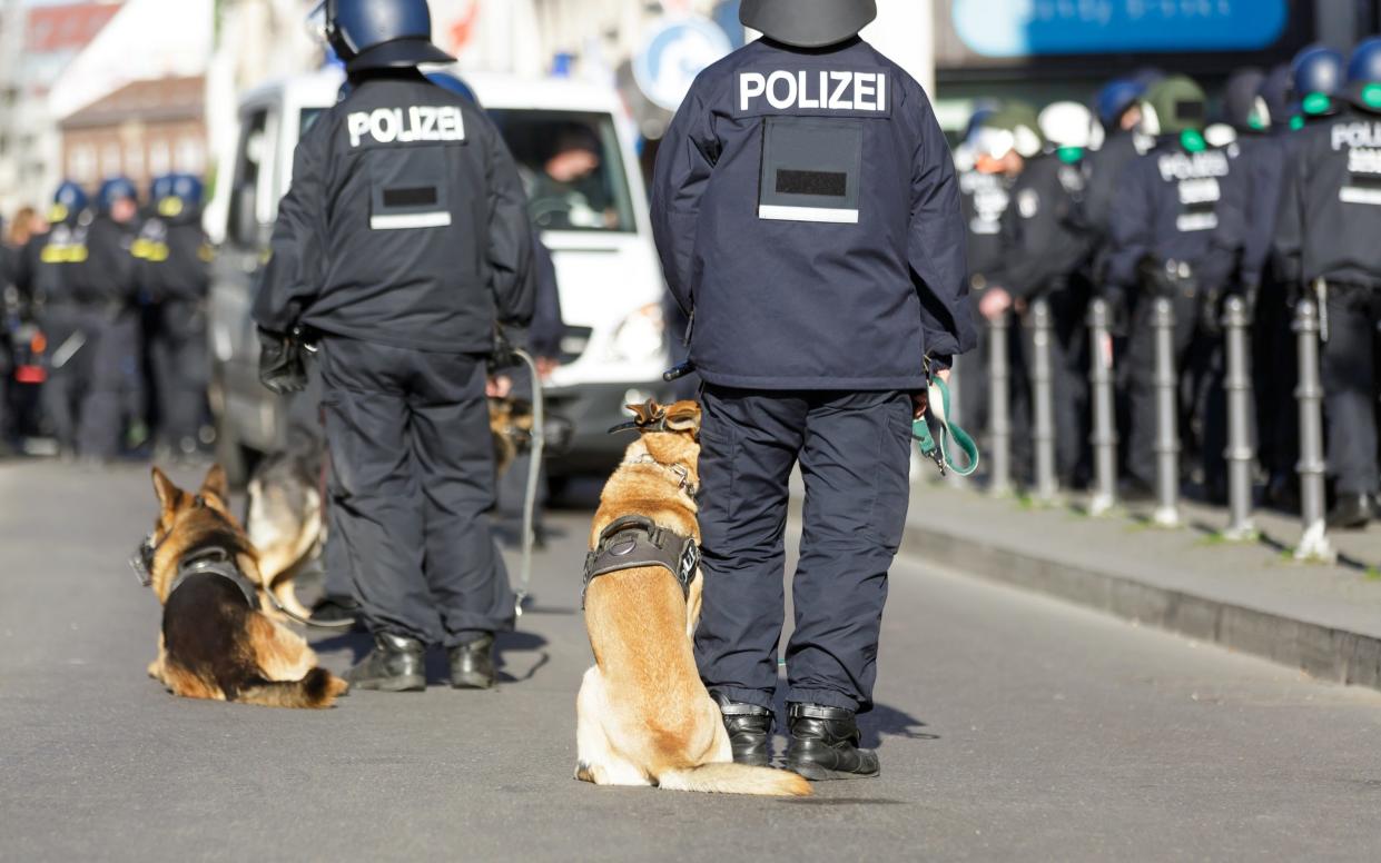 German prosecutors said three suspects had been caught 'scouting' a café in Frankfurt