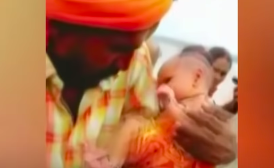 A boatman in Uttar Pradesh became a local star when he brought home an abandoned 21-day-old girl child he had found near the banks of river Ganges. The local authorities have taken the infant to a hospital and doctors are monitoring her health (Hindustan Times YouTube/Screengrab)