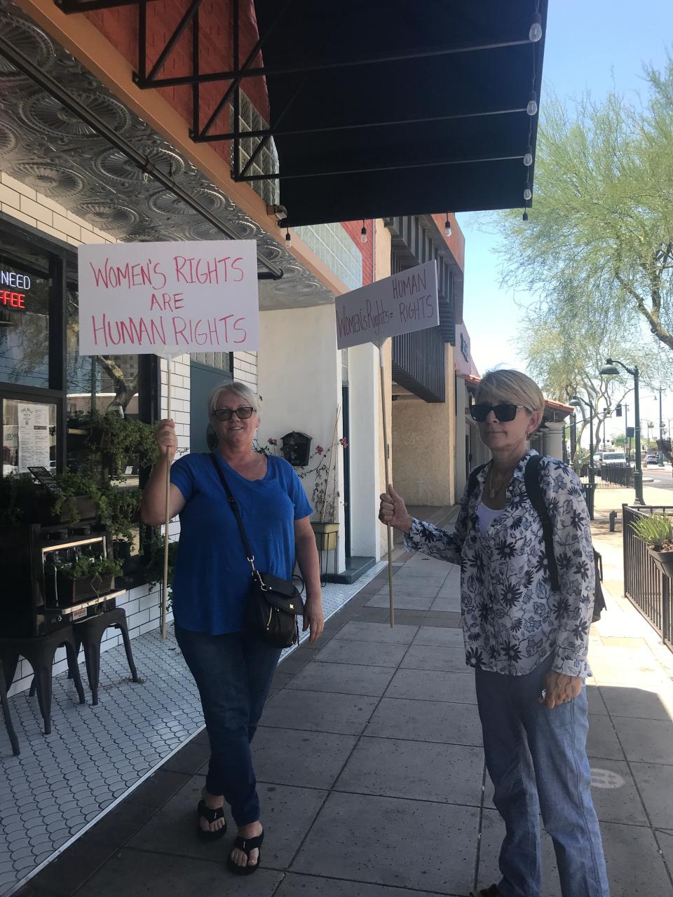Anisa Gracanin (left) and Judy Drayer (right) walk the streets of downtown Mesa to protest the U.S. Supreme Court ruling on Roe v. Wade.