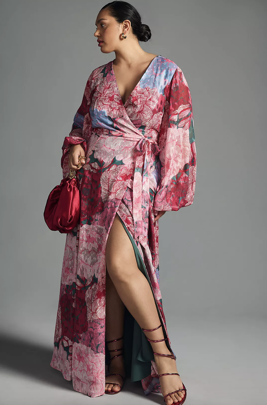 plus size model wearing pink floral Hutch Long-Sleeve Wrap Dress (photo via Anthropologie)