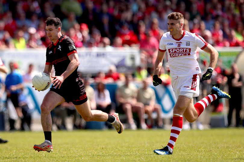 Louth’s Craig Lennon in action against Cork's Ian Maguire during last Sunday's preliminary quarter-final in Inniskeen