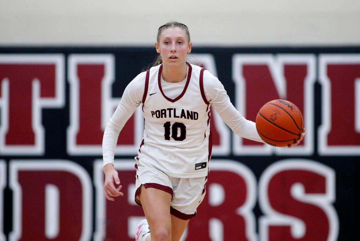 Portland's Ashley Bower brings the ball up court against Lansing Catholic, Friday, Feb. 18, 2022, in Portland. Portland won 53-41.