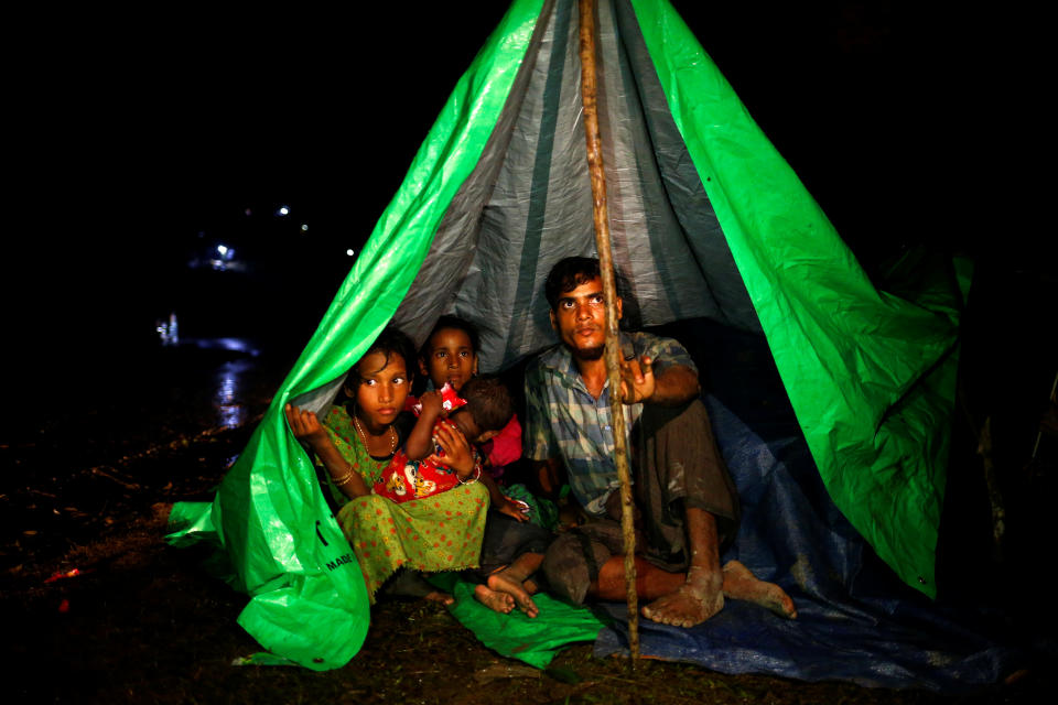 <p>Rohingya refugees sit inside a makeshift tent near Gundum in Cox’s Bazar, Bangladesh, Sept. 3, 2017. (Photo: Mohammad Ponir Hossain/Reuters) </p>