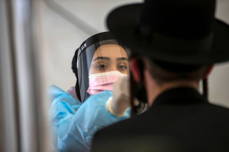 FILE PHOTO: People returning from overseas arrive at Ben Gurion International Airport