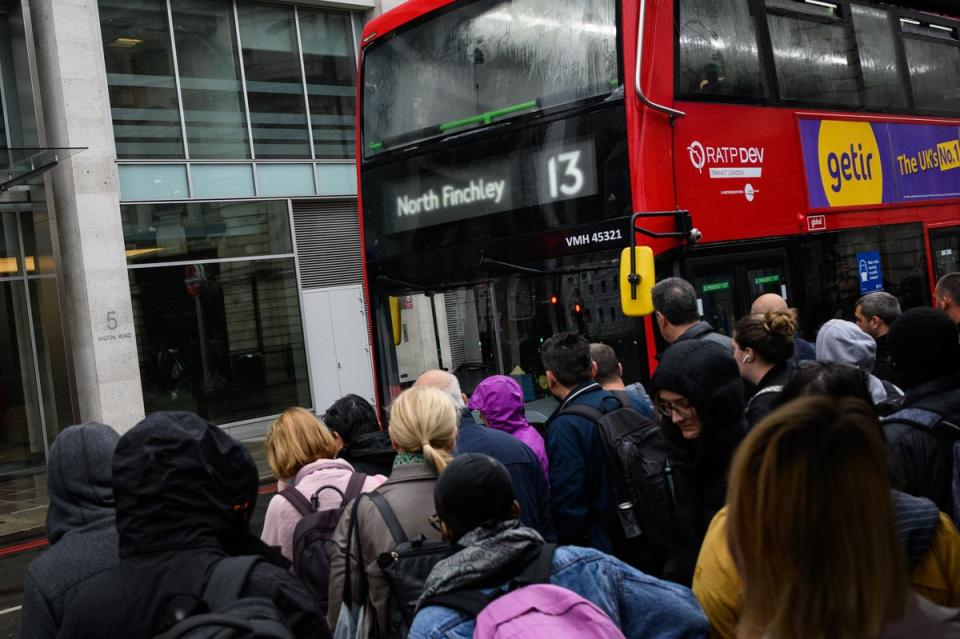 Commuters queue to board packed buses at Victoria Station as a tube strike impacts the Monday morning rush hour (Getty Images)