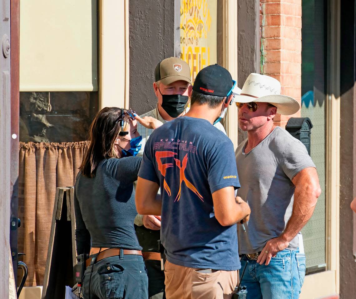 Show creator Taylor Sheridan, right, in a discussion with his film crew. “1883,” a sequel to popular Paramount drama “Yellowstone,” filmed scenes in Granbury’s historic square in summer of 2021.